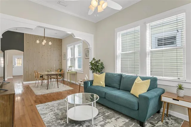 a living room with furniture and a large window