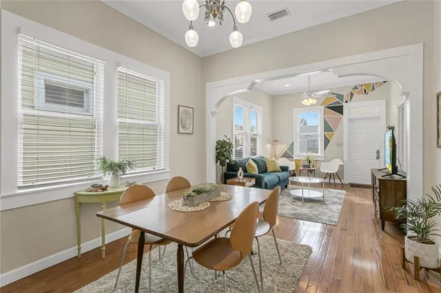a view of a dining room with furniture window and wooden floor