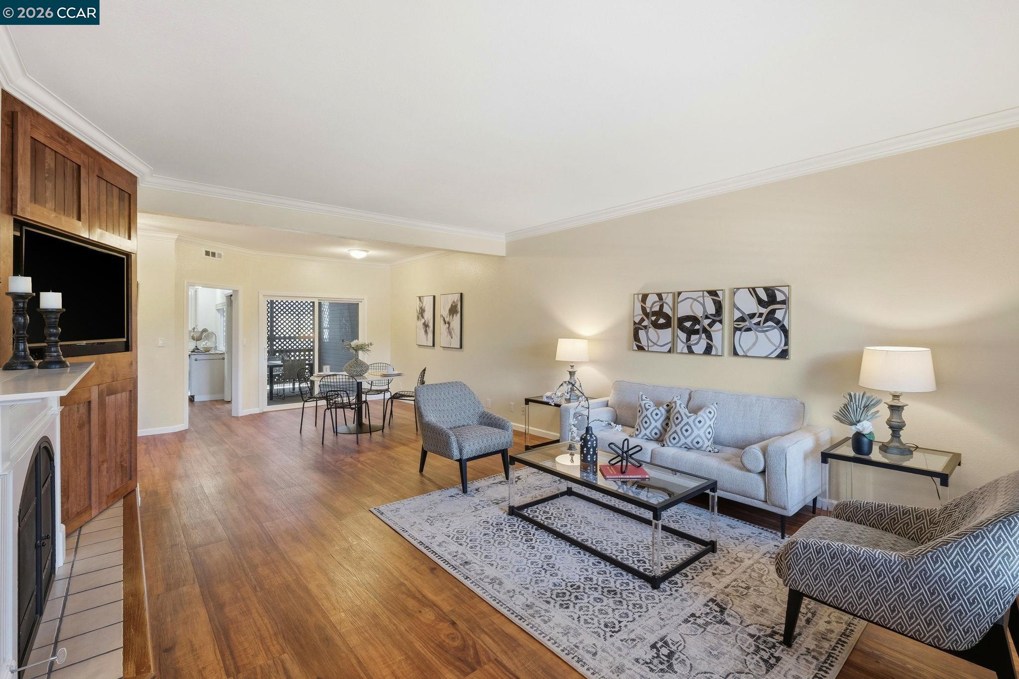 1707 Geary Road Walnut Creek, CA 94597 - Photo 6 of 43 a living room with furniture and a flat screen tv