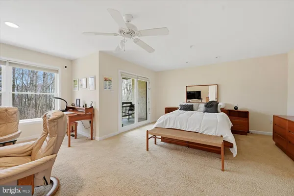 a bedroom with furniture and a window