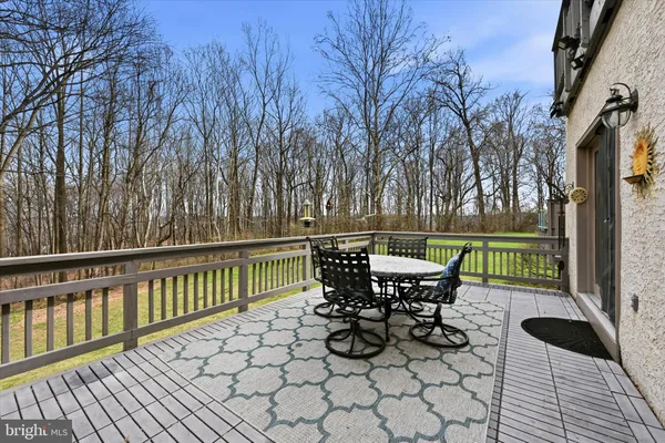 a view of a chairs and table on the deck