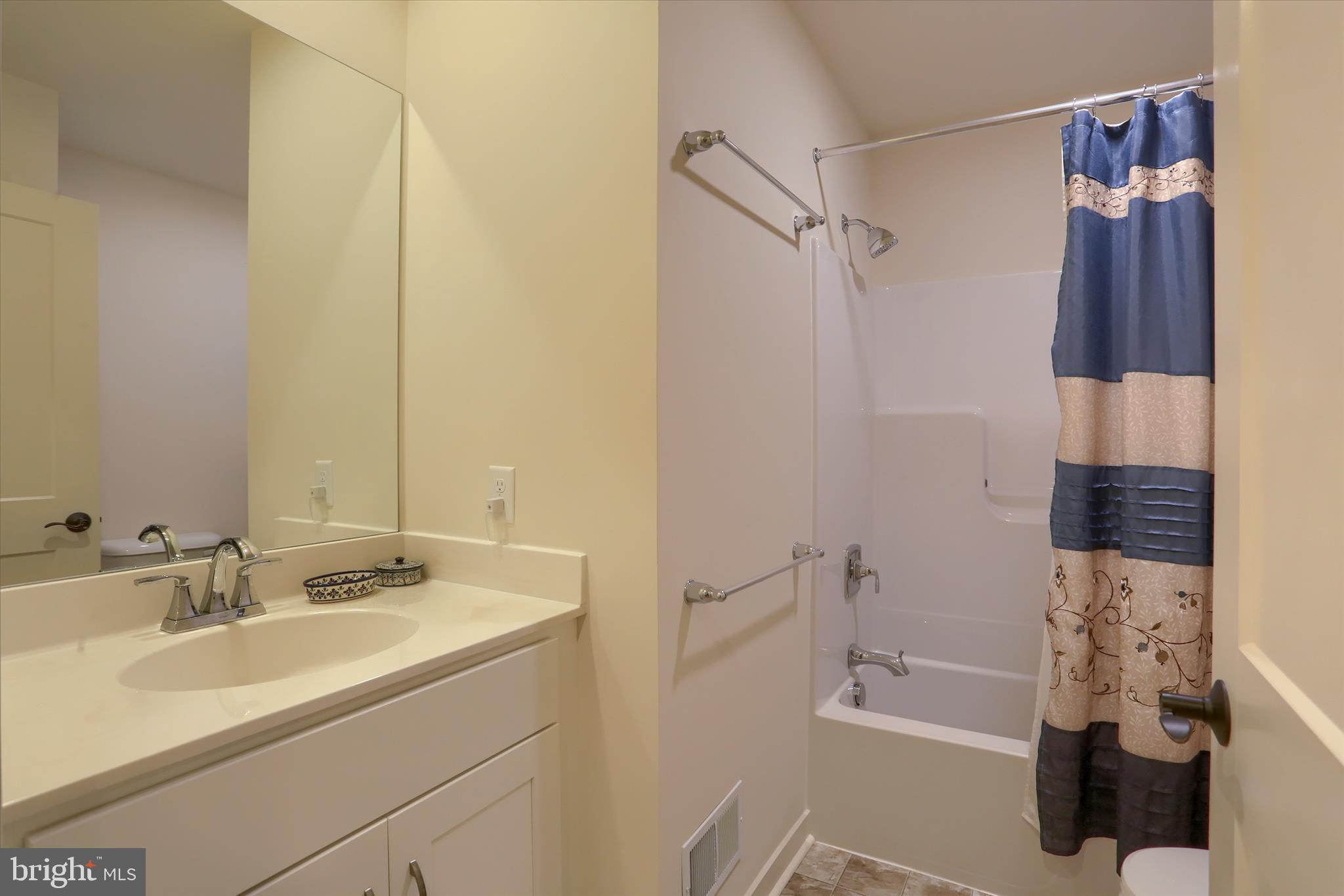 6238 Overview Lane Harrisburg, PA 17111 - Photo 16 of 34 a bathroom with a sink and a mirror