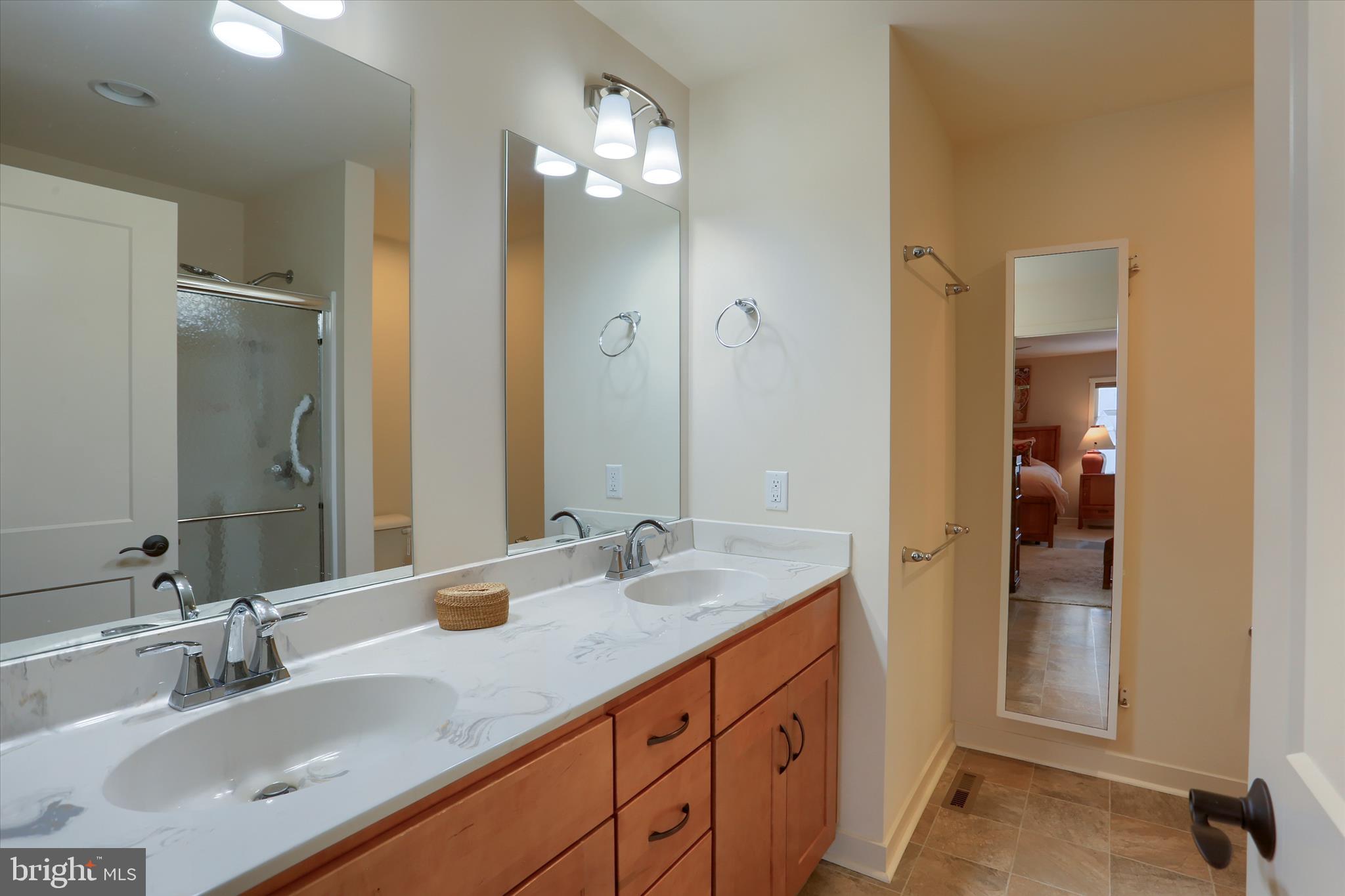 6238 Overview Lane Harrisburg, PA 17111 - Photo 21 of 34 a bathroom with a double vanity sink and a mirror
