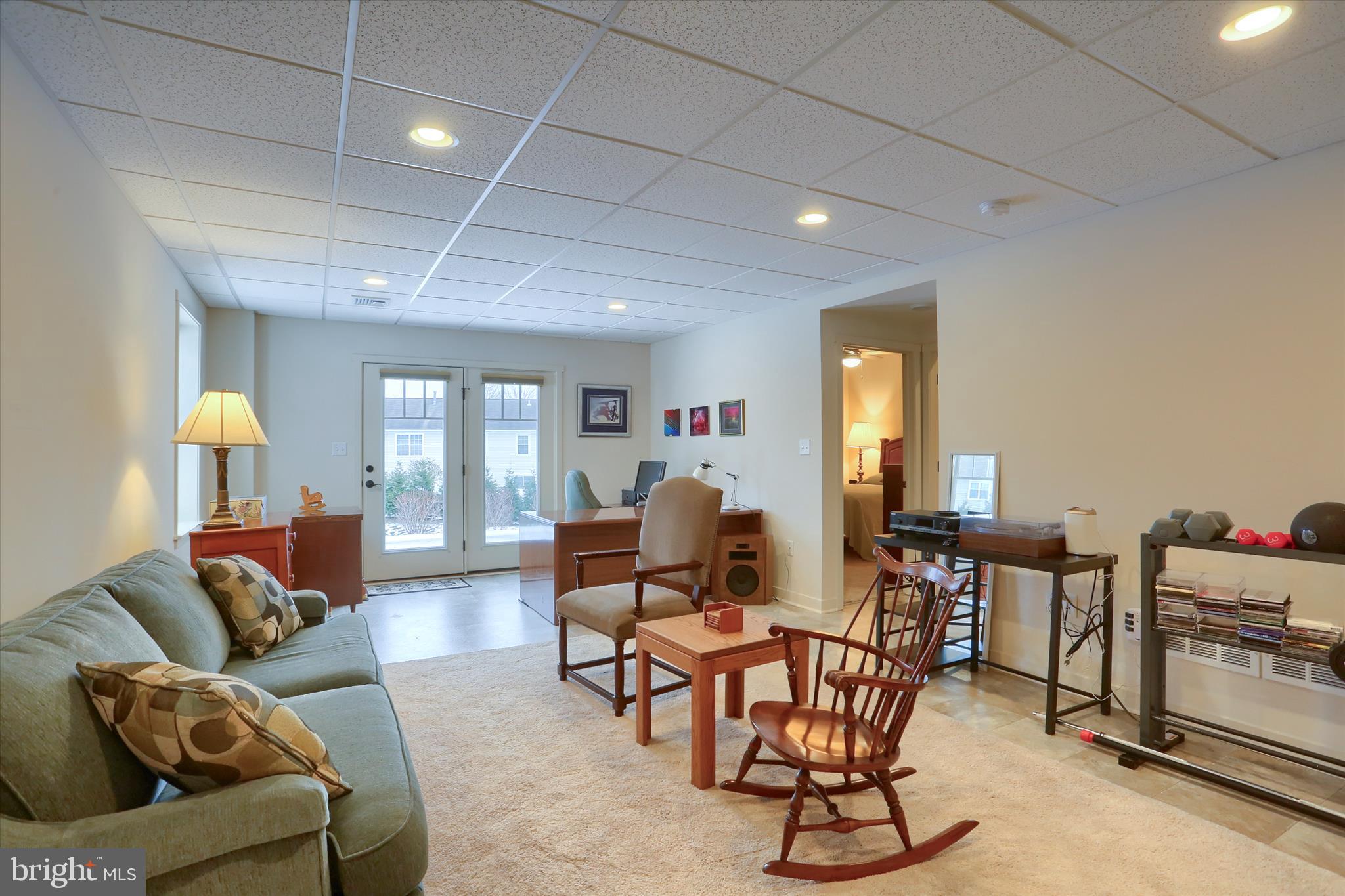 6238 Overview Lane Harrisburg, PA 17111 - Photo 23 of 34 a living room with furniture and a dining table with wooden floor