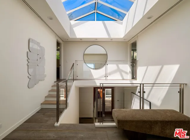 a view of a hallway with seating space