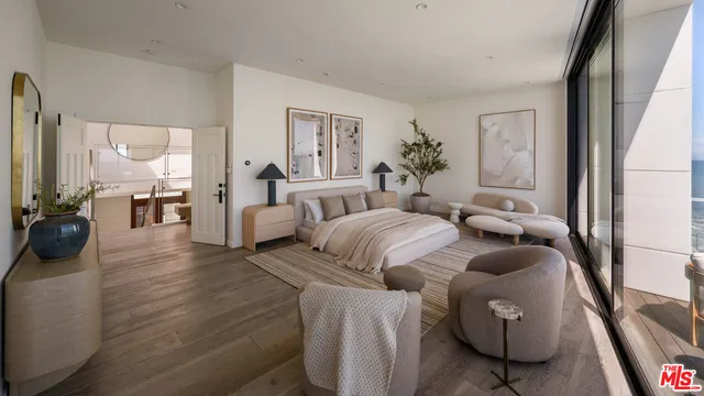 a bedroom with furniture and a wooden floor