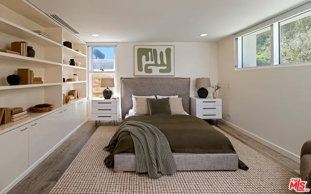 a bedroom with a bed and closet