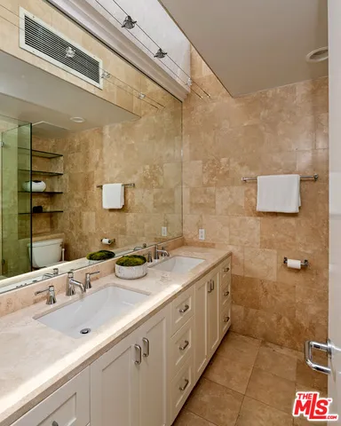 a bedroom with bed and window