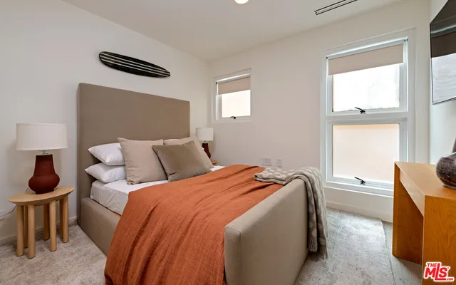 a spacious bathroom with a granite countertop sink and a mirror
