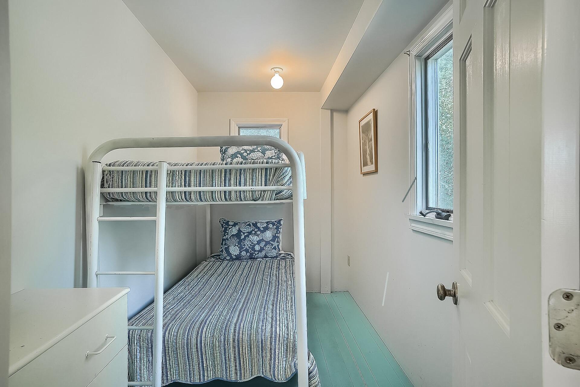 8 Standish Road Orleans, MA 02653 - Photo 15 of 28 a bedroom with a bed and wooden floor