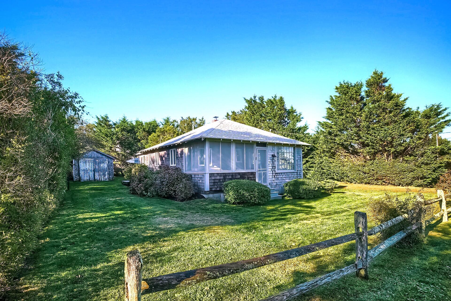 8 Standish Road Orleans, MA 02653 - Photo 2 of 28 a view of a wooden house with a big yard plants and large trees