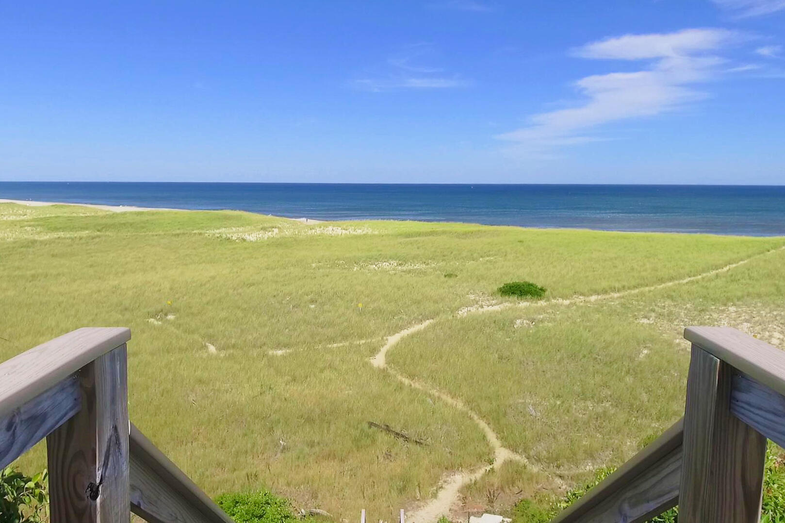 8 Standish Road Orleans, MA 02653 - Photo 26 of 28 a view of an ocean from a balcony