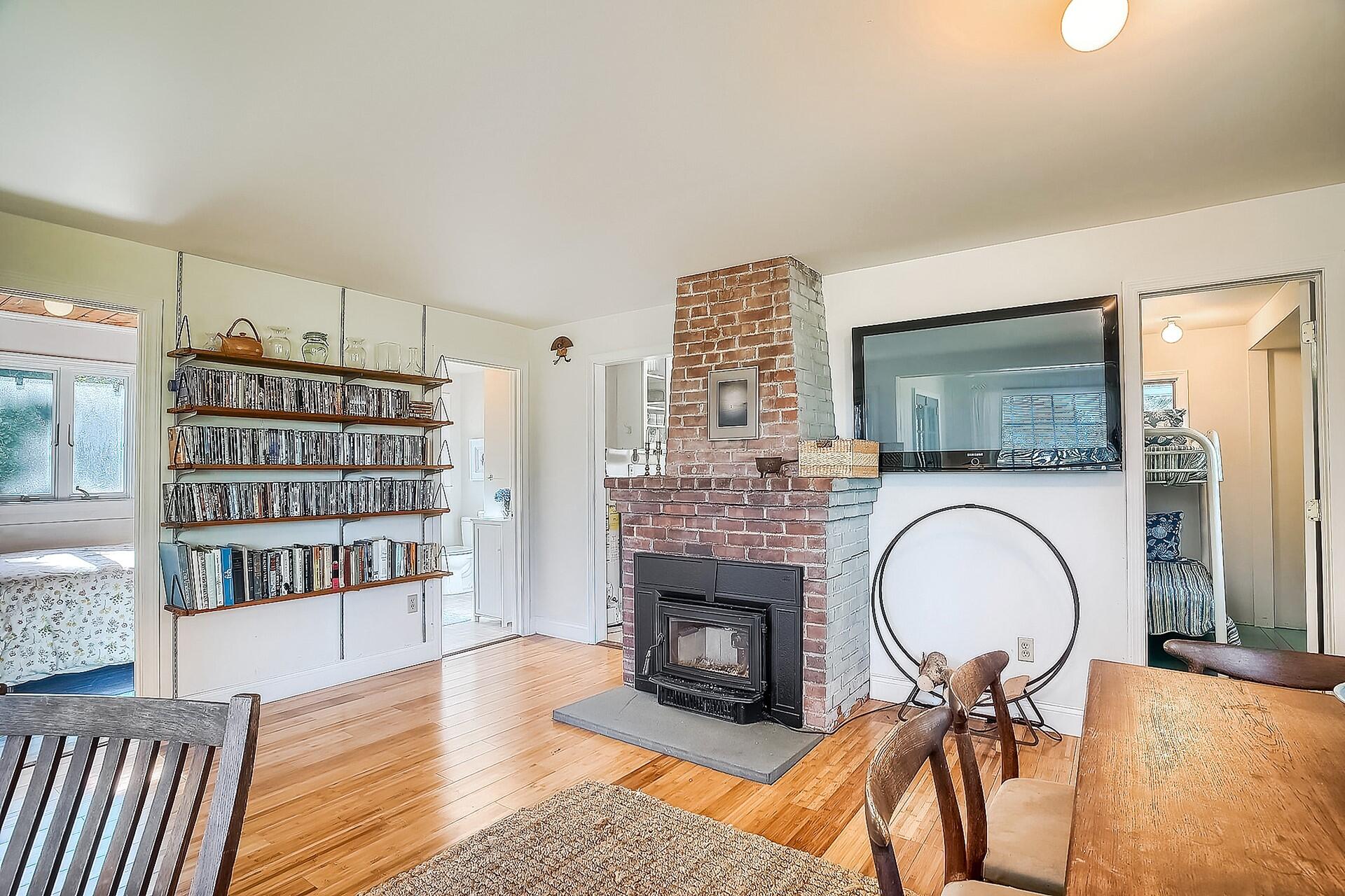 8 Standish Road Orleans, MA 02653 - Photo 5 of 28 a living room with fireplace furniture and a wooden floor