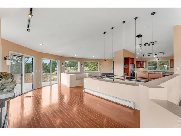 a view of a living room and kitchen floor