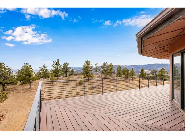 a view of a balcony with wooden floor
