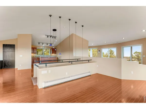 a view of kitchen with wooden floor