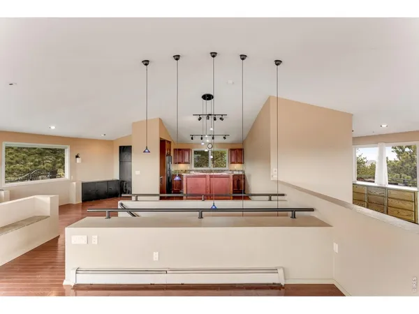 a living room with a bed and a window