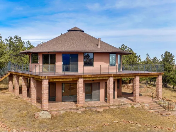 a view of a town with mountains in the background