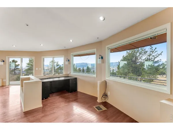a room with furniture and large windows