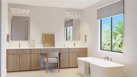 a bathroom with a double vanity sink a mirror and a bathtub