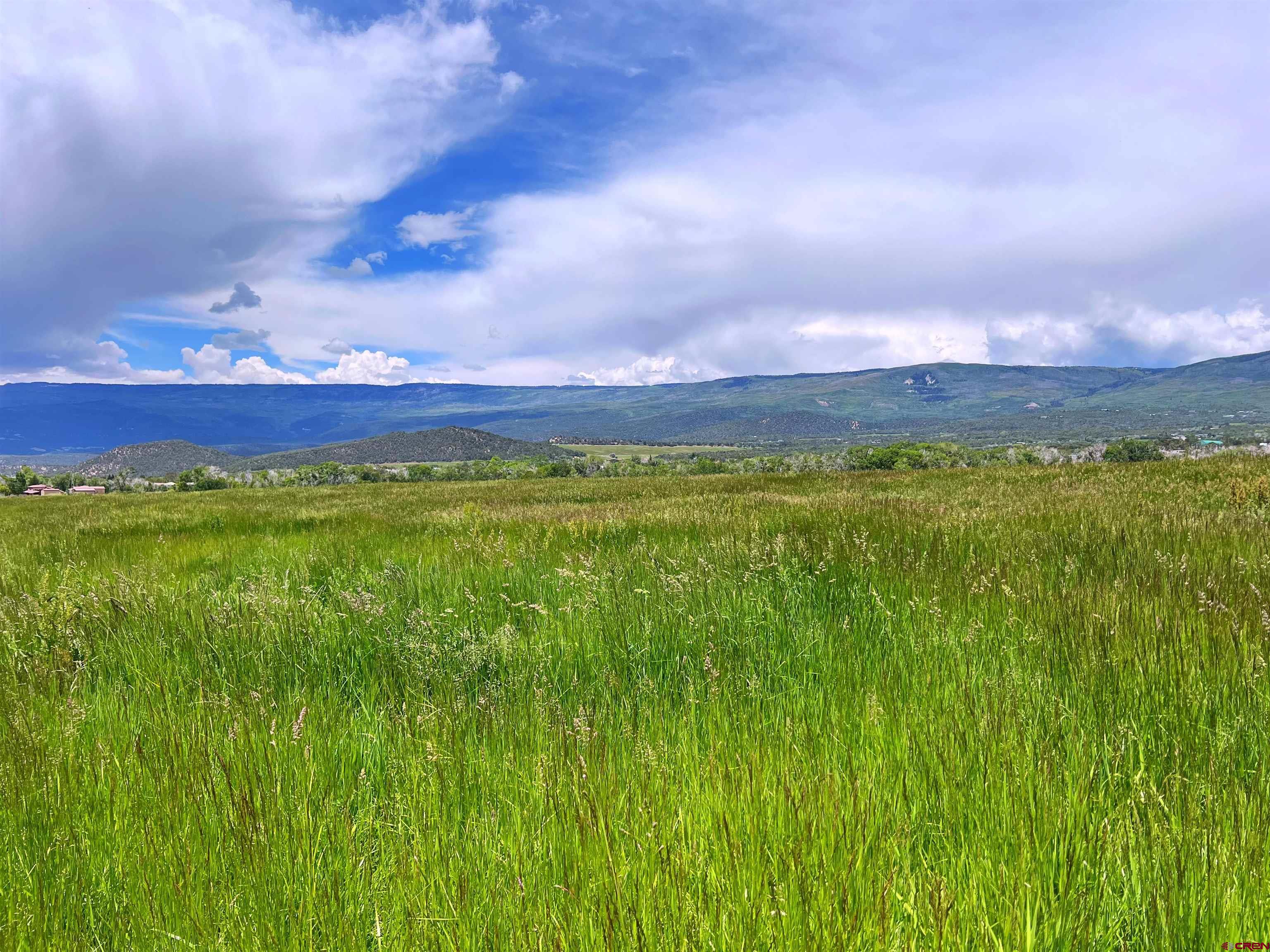 65 Highway 65 Cedaredge, CO 81413 - Photo 1 of 15 a view of a lake and sunset