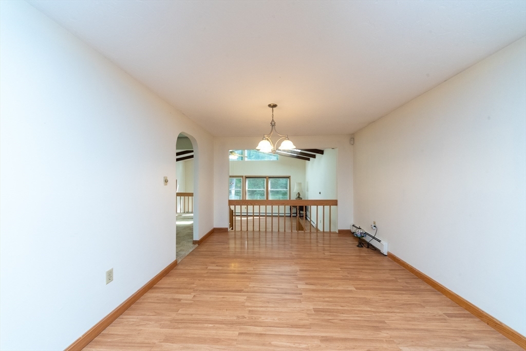 205 Beaman Road Sterling, MA 01564 - Photo 15 of 41 a view of a livingroom with a furniture wooden floor and a window