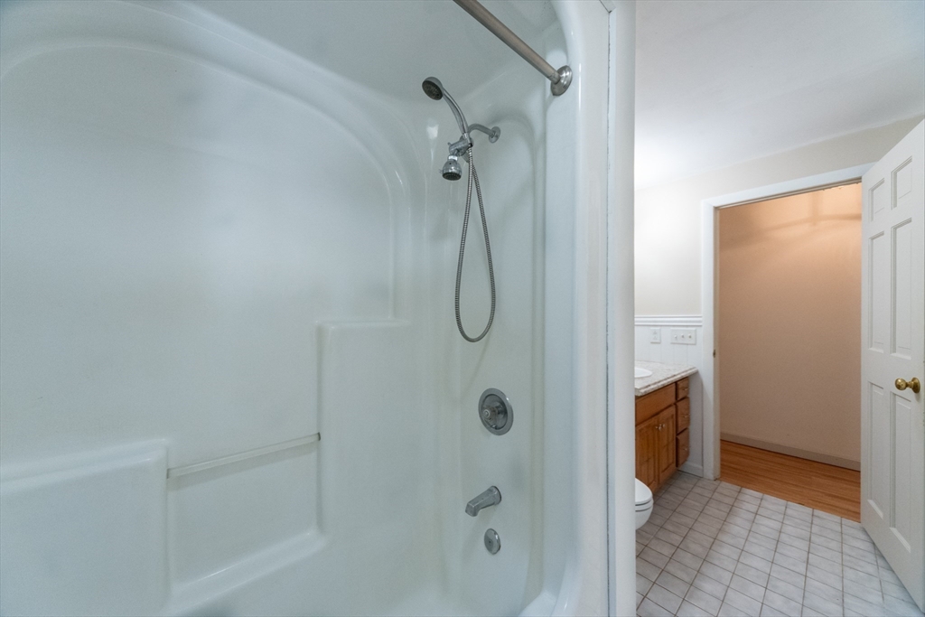 205 Beaman Road Sterling, MA 01564 - Photo 19 of 41 a bathroom with a glass shower door