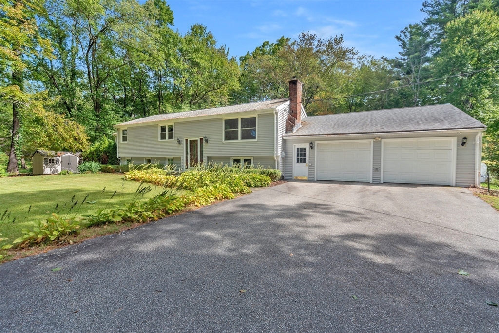 205 Beaman Road Sterling, MA 01564 - Photo 2 of 41 a front view of a house with garden