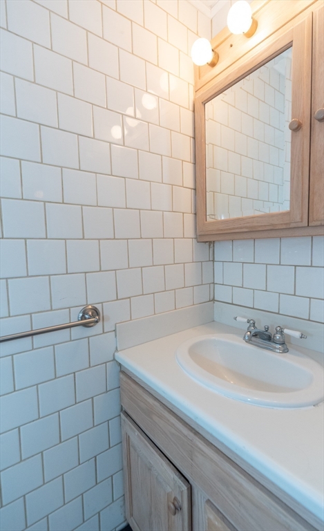 205 Beaman Road Sterling, MA 01564 - Photo 22 of 41 a bathroom with a sink and a shower