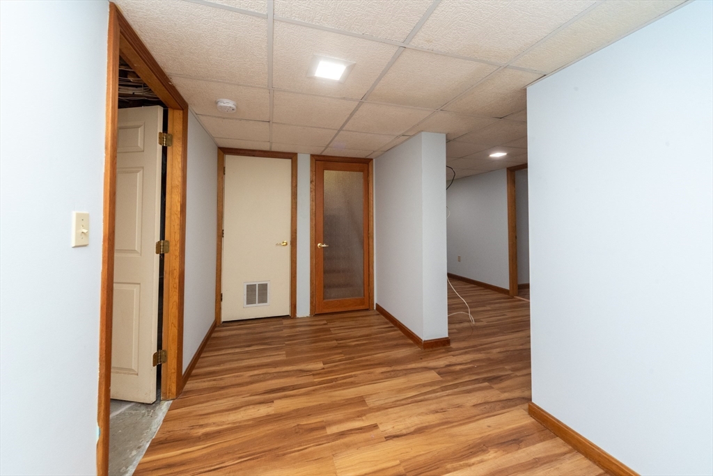 205 Beaman Road Sterling, MA 01564 - Photo 27 of 41 a view of a hallway with wooden floor