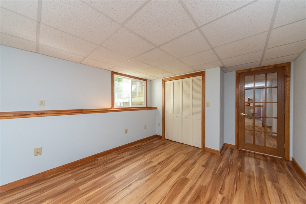 205 Beaman Road Sterling, MA 01564 - Photo 29 of 41 a view of empty room with wooden floor and fan