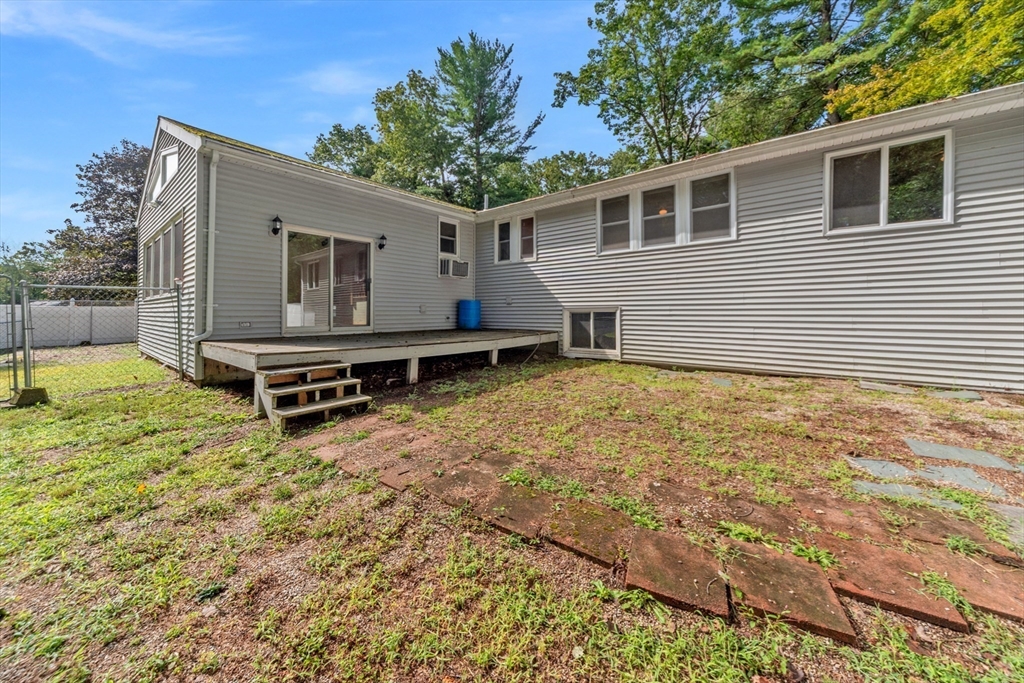 205 Beaman Road Sterling, MA 01564 - Photo 35 of 41 a backyard of a house with table and chairs