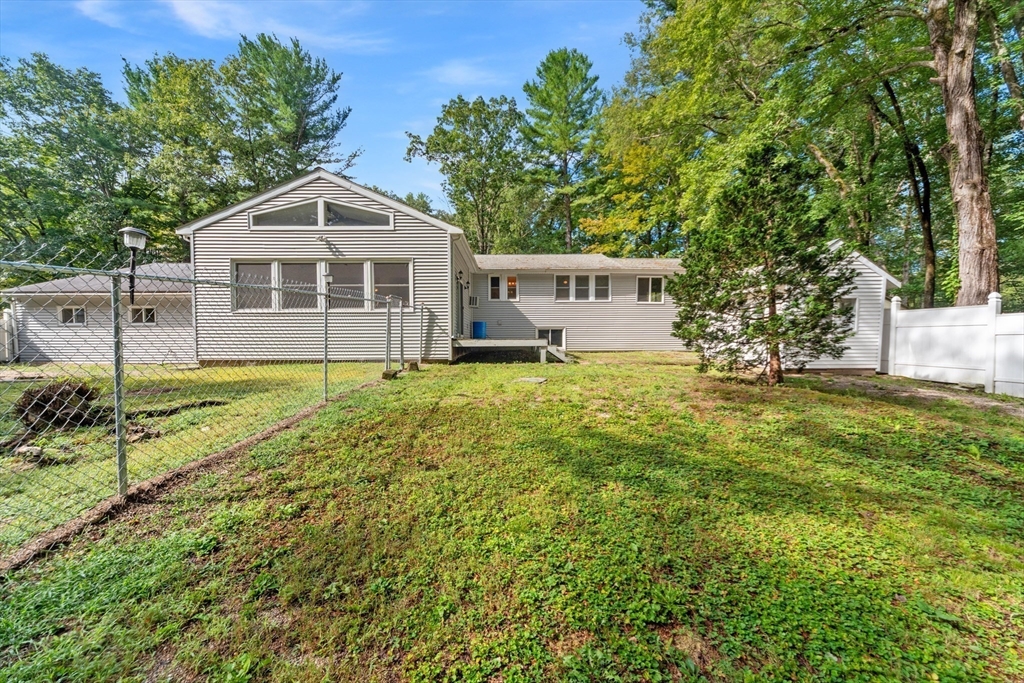 205 Beaman Road Sterling, MA 01564 - Photo 37 of 41 a view of a house with a yard