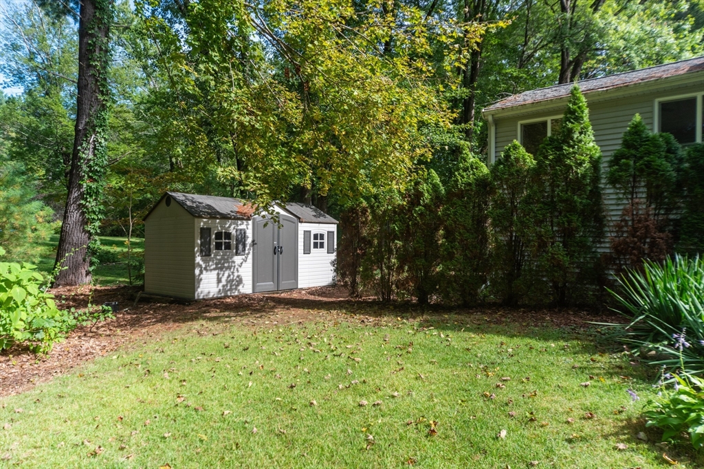 205 Beaman Road Sterling, MA 01564 - Photo 38 of 41 a view of a house with a yard and tree