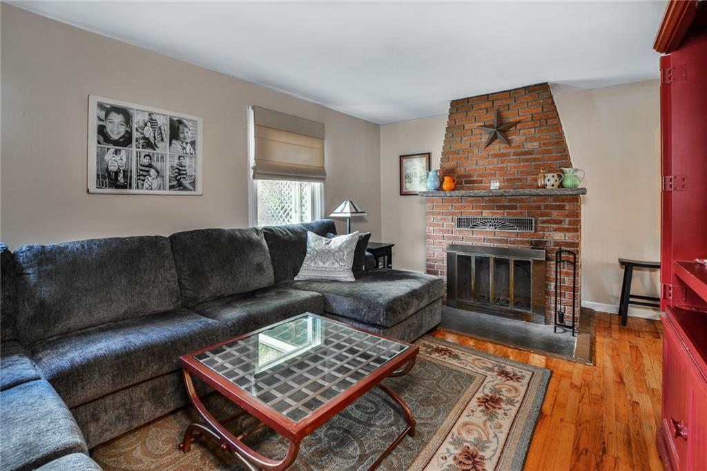 131 Inwood Road Pittsburgh, PA 15237 - Photo 5 of 25 a living room with furniture and a fireplace