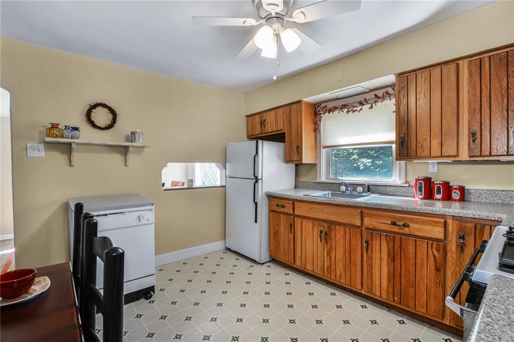 131 Inwood Road Pittsburgh, PA 15237 - Photo 7 of 25 a kitchen with a sink appliances cabinets and furniture