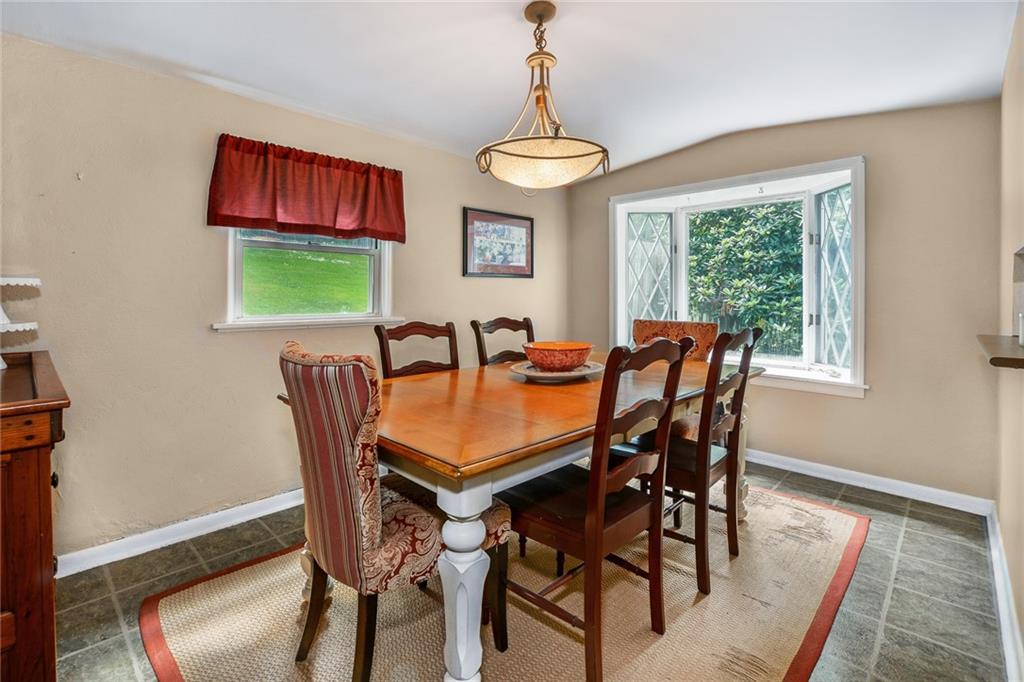 131 Inwood Road Pittsburgh, PA 15237 - Photo 9 of 25 a dining room with furniture a window and a chandelier