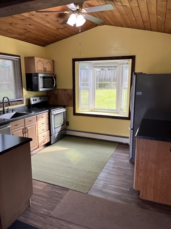 56 Shore Drive Upton, MA 01568 - Photo 7 of 23 a kitchen with stainless steel appliances granite countertop a stove a sink and a microwave
