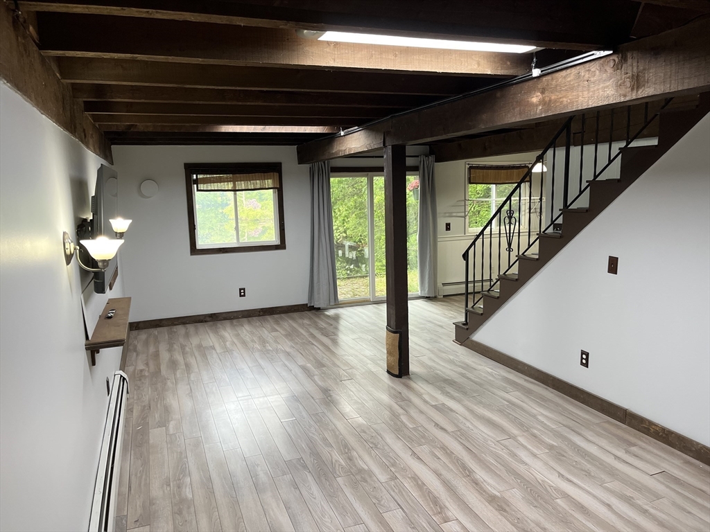 56 Shore Drive Upton, MA 01568 - Photo 9 of 23 a view of empty room with wooden floor