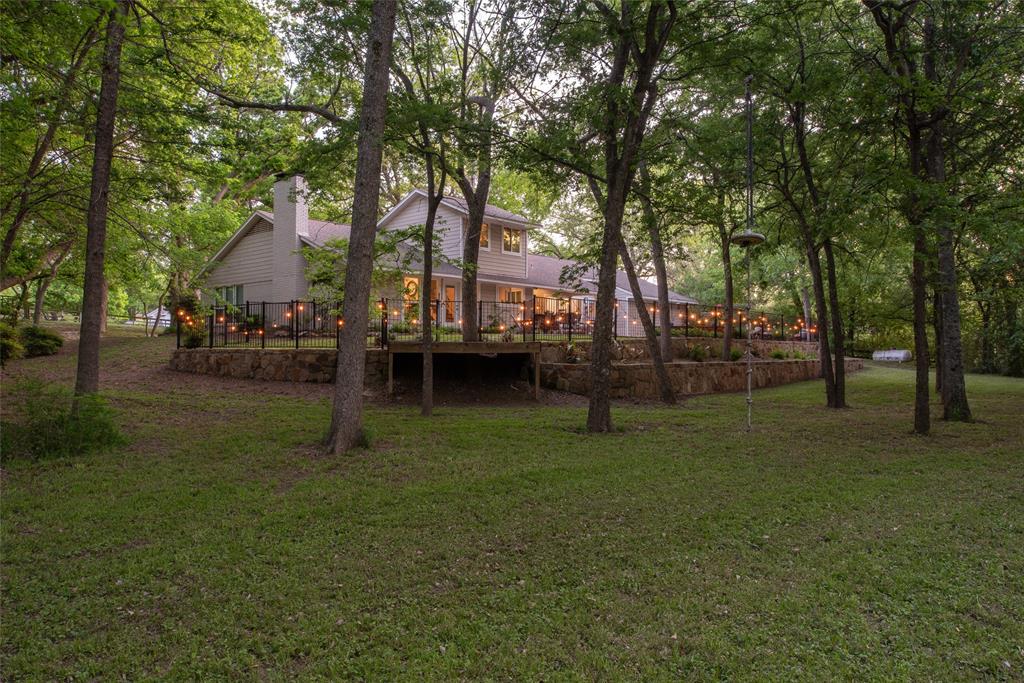 1451 Meandro Ria Lane Fairview, TX 75069 - Photo 37 of 38 a view of outdoor space with deck and trees