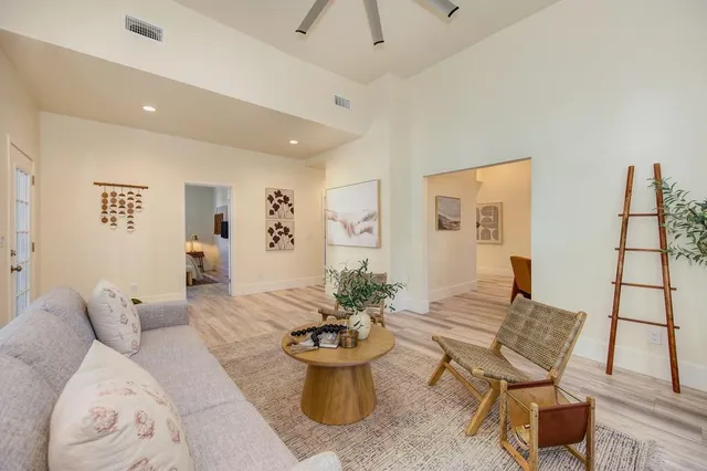 a view of kitchen with granite countertop sink and cabinets