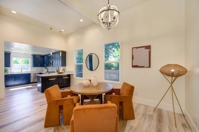 a kitchen with stainless steel appliances granite countertop wooden cabinets and a stove top oven