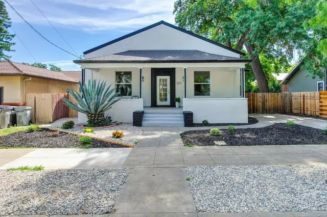 a front view of a house with entryway and wooden floor