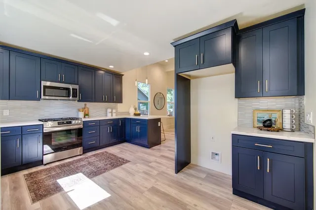 a bedroom with a bed and a potted plant