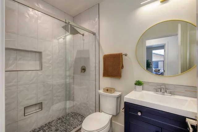 a backyard of a house with a tree