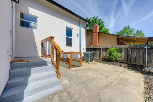a view of a house with a yard and garage