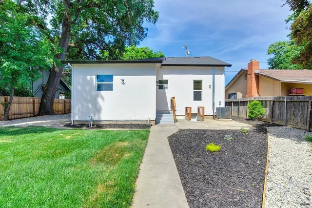 a kitchen with stainless steel appliances a stove sink microwave and cabinets