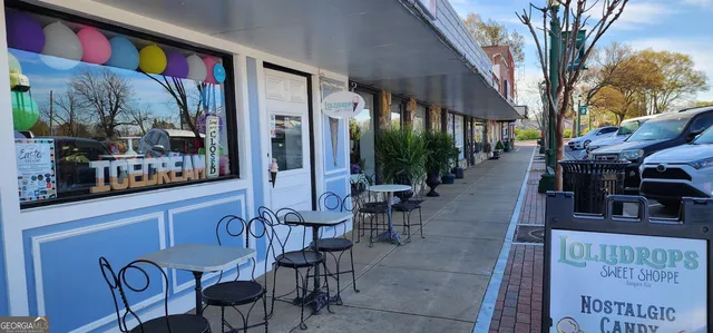a view of a chairs and tables in patio