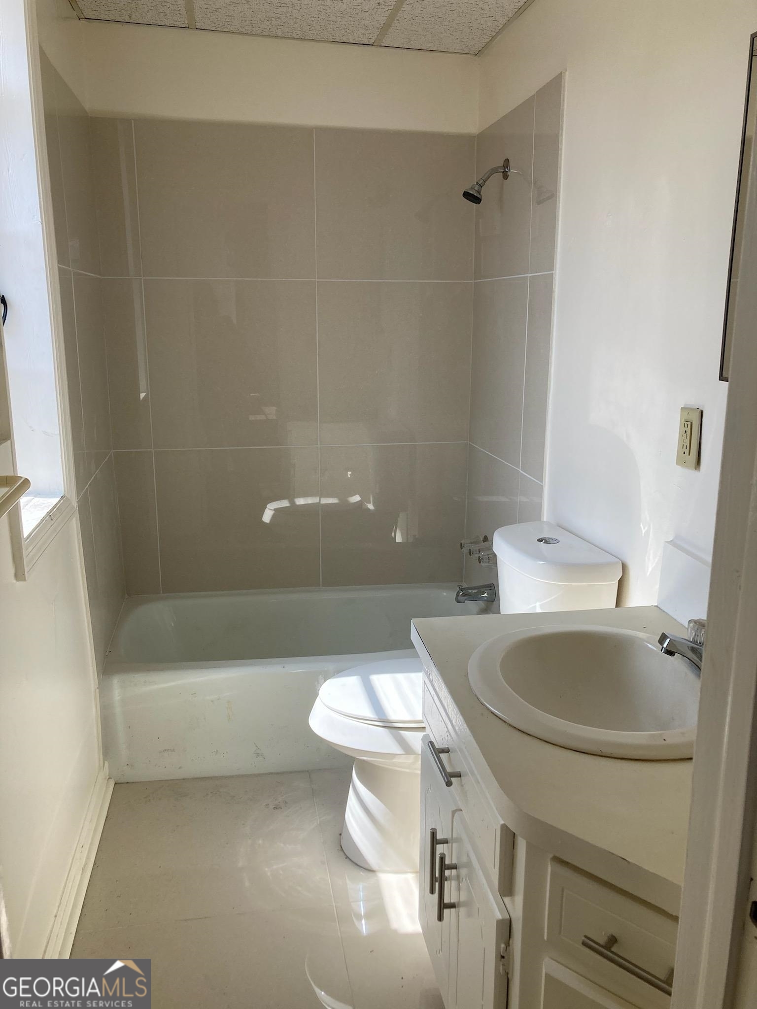 1529 South 1529 S Main Street, Unit 3 Jasper, GA 30143 - Photo 14 of 14 a bathroom with a sink a toilet and shower