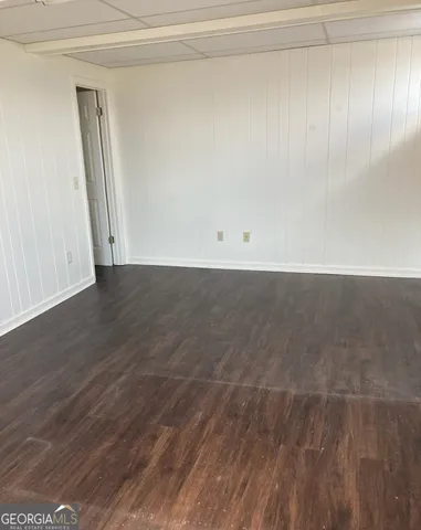 a view of a livingroom with wooden floor